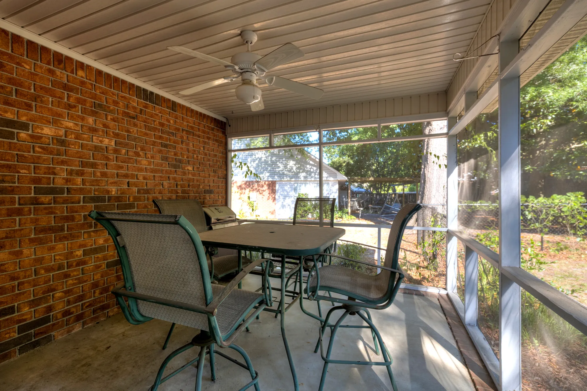 Cumberland East — screened back porch with patio seating