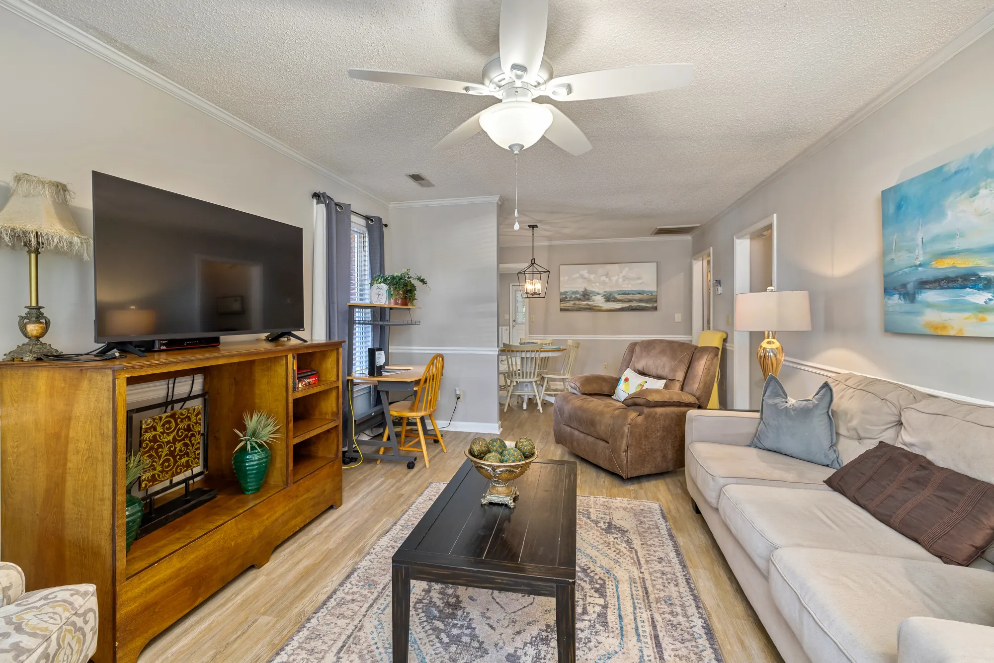 Cumberland East — living room with Smart TV open to the dining area