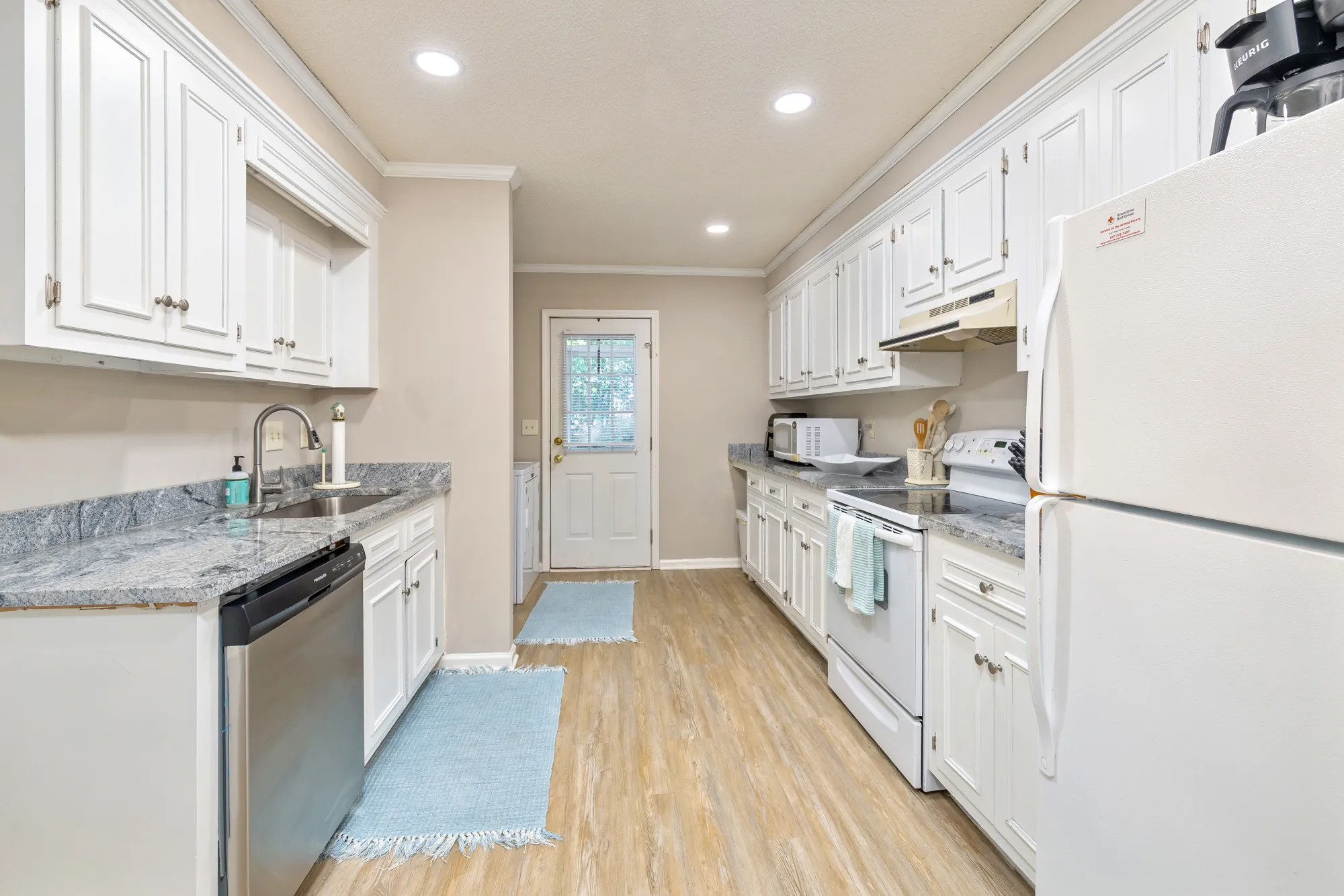 Cumberland East — kitchen with granite counters and stainless dishwasher