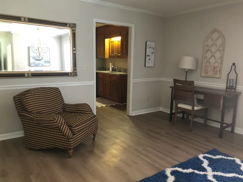 Cumberland West — sitting area with desk workspace