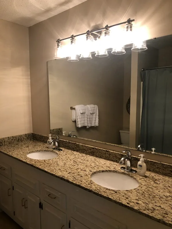Cumberland West — primary bathroom with dual-sink granite vanity