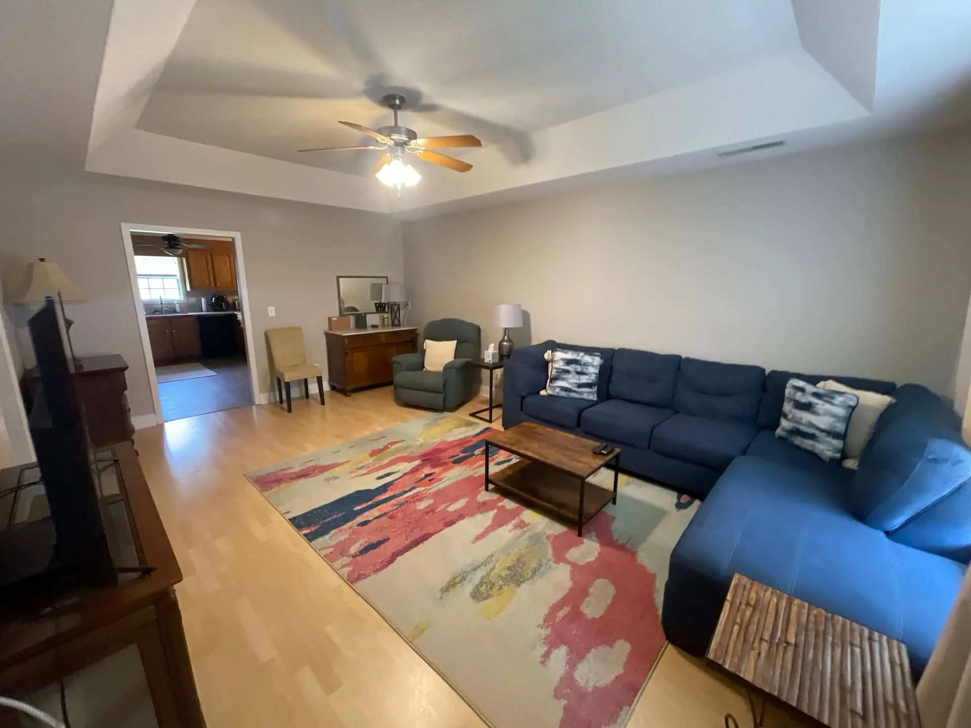 Horizon — living room with sectional sofa open to the kitchen