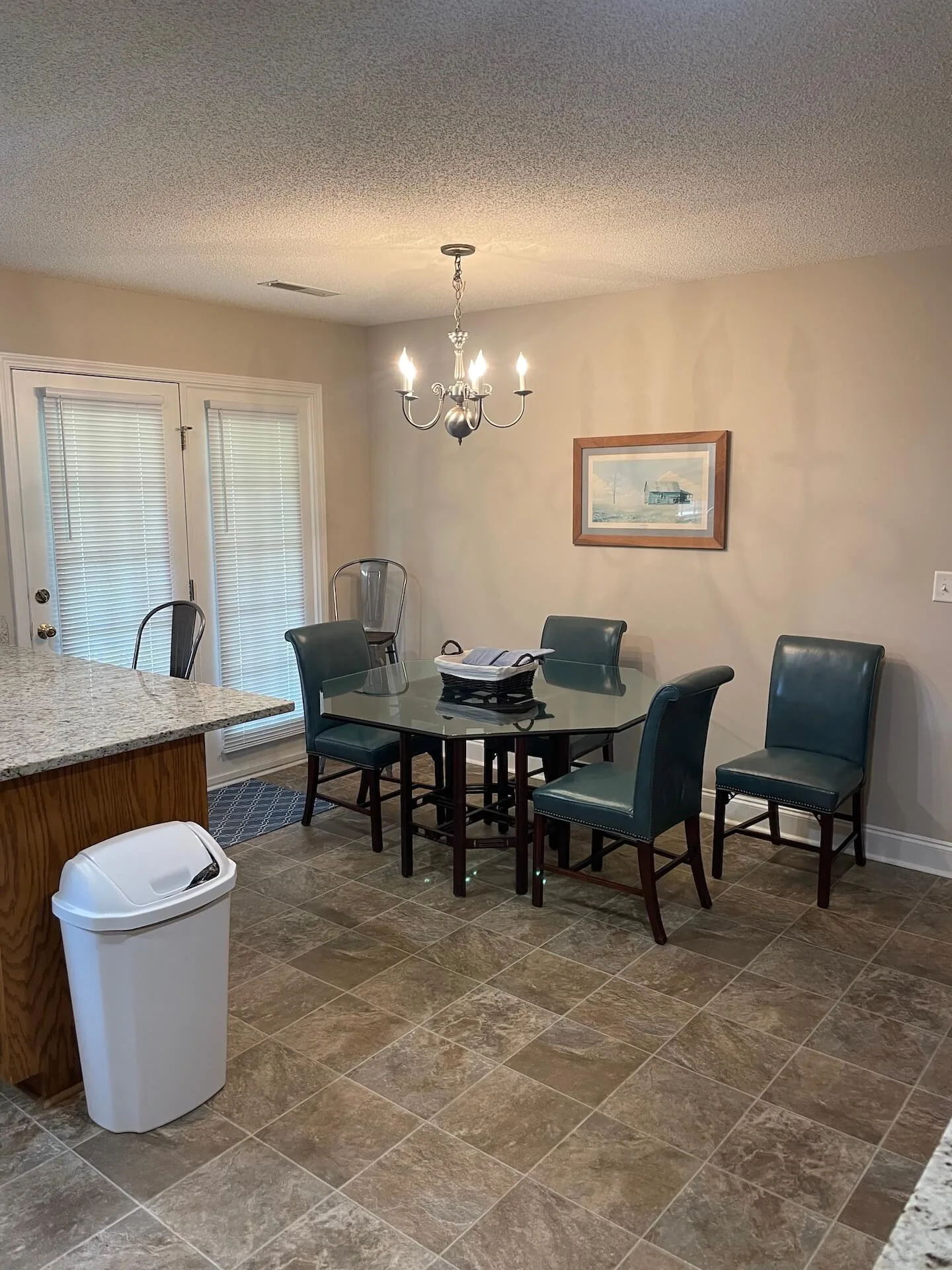 Horizon — dining area with glass table seating for four