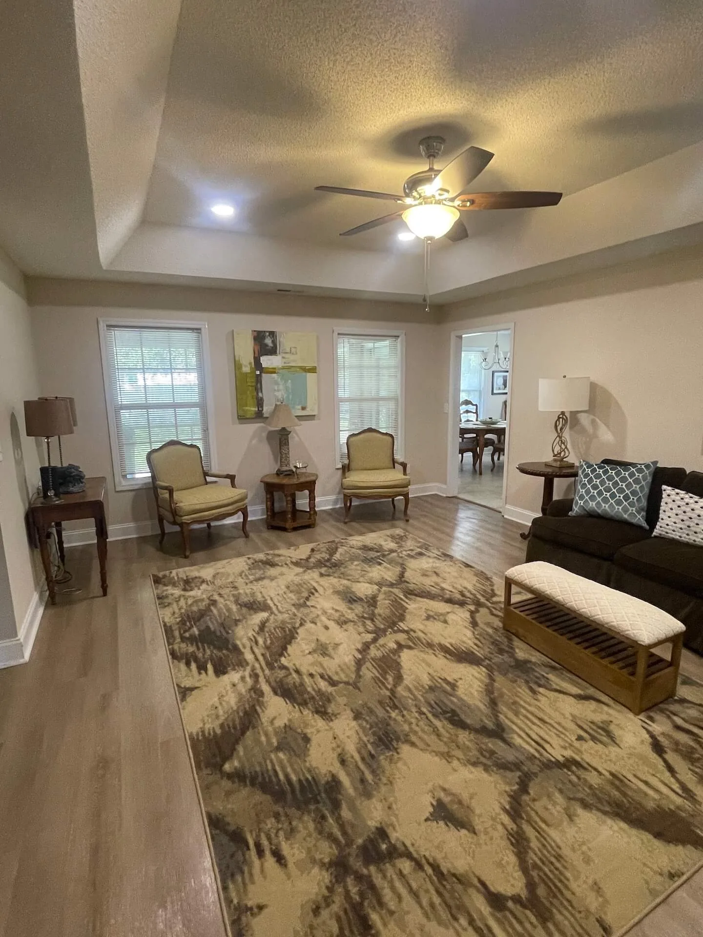 Landmark — formal living room with tray ceiling and seating